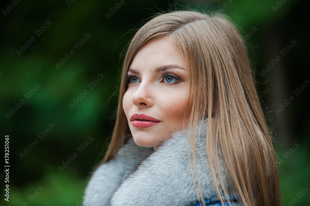 Beautiful young blonde woman wearing fur autumn coat Beautiful young blonde woman wearing fur autumn coat