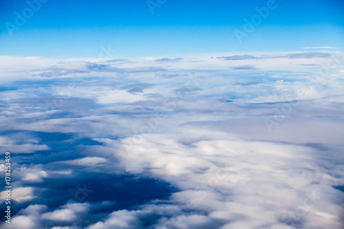 Beautiful, dramatic clouds and sky viewed from the plane 