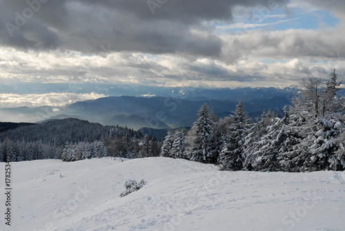 View of the winterly Austrian and Slovenian alps from mountain Schöckl, Graz, Austria © Alexander