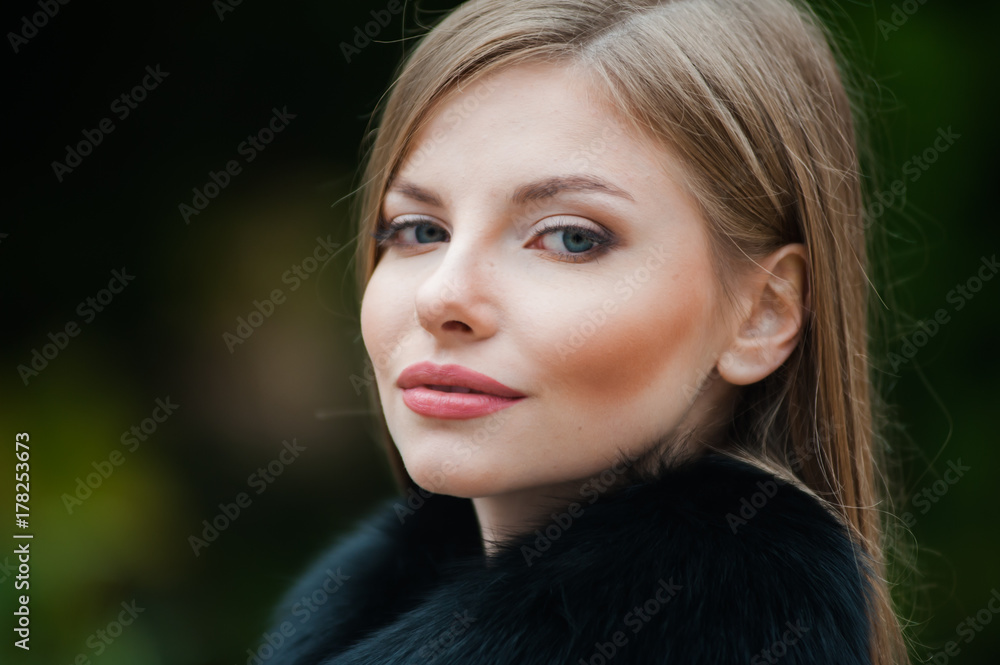 Beautiful young blonde woman wearing fur autumn coat Beautiful young blonde woman wearing fur autumn coat