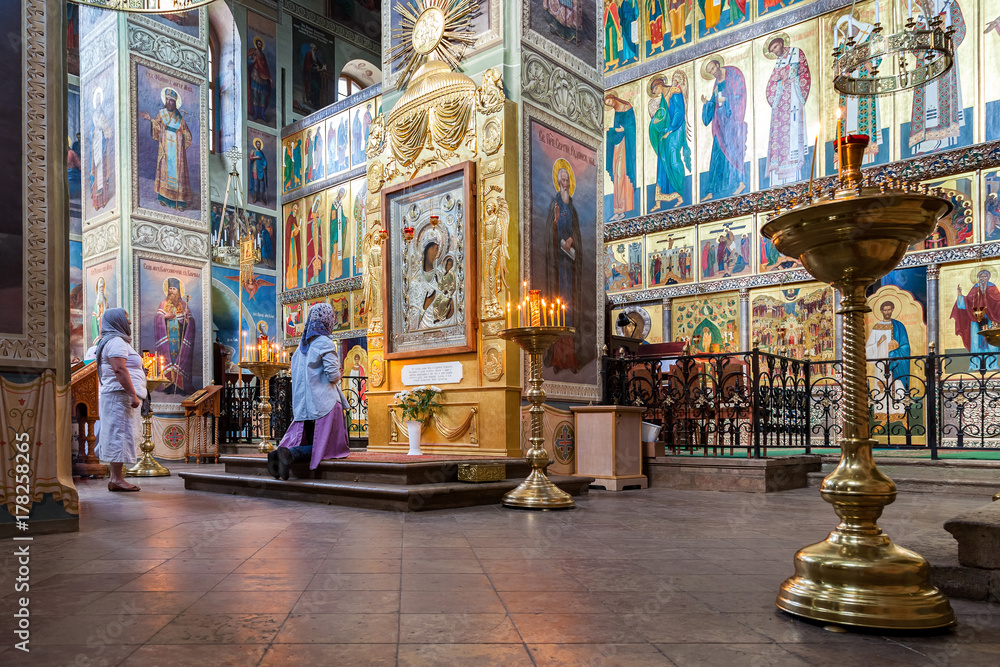 Orthodox Christians inside the Assumption Cathedral of the Valdai Iversky Monastery, Russia