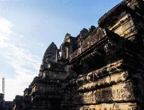 The yellow sunlight shining toward the famous ancient construction of an southeast asia country, Angor Wat of Cambodia. Its one the world's 7 wonders and heritage