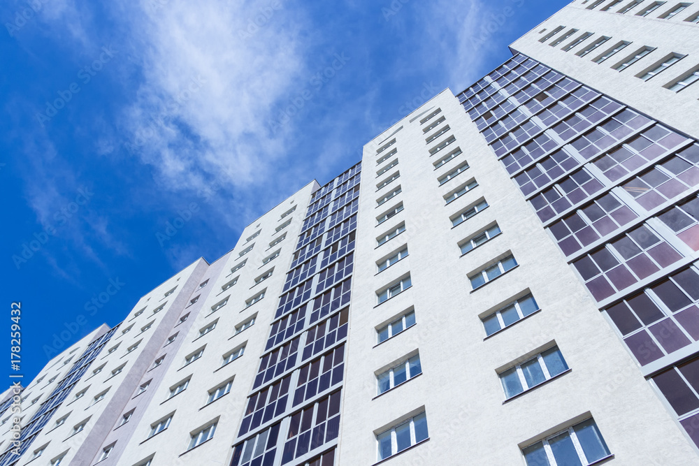 New tall apartment building against the sky