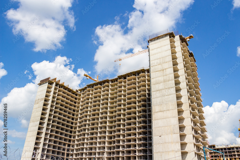 Construction of an apartment building on the sky background Construction of an apartment building on the sky background
