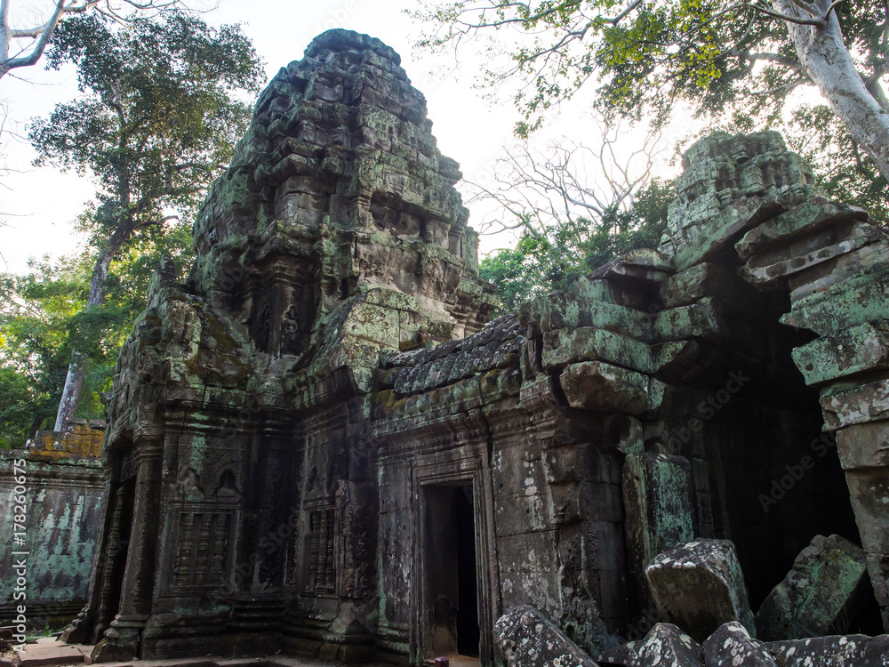 The old scary collapsed castle inside the ancient forest. The place is the most famous landmark of Cambodia, Angor Thom inside Angor Wat area, one of the world’s 7 wonders and heritage The old scary collapsed castle inside the ancient forest. The place is the most famous landmark of Cambodia, Angor Thom inside Angor Wat area, one of the world’s 7 wonders and heritage