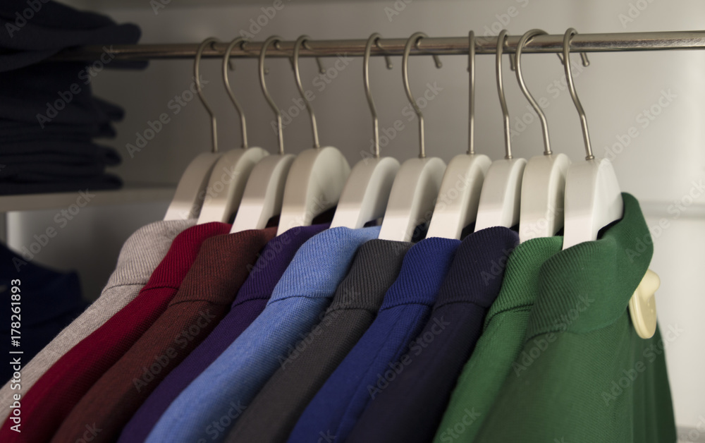 Camisas en un perchero de ropa multicolor Stock Photo | Adobe Stock