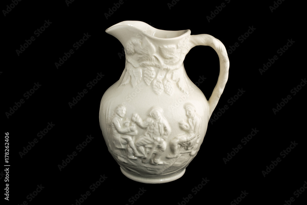 Old porcelain vase. Three men drinking and laughing. Black isolated.