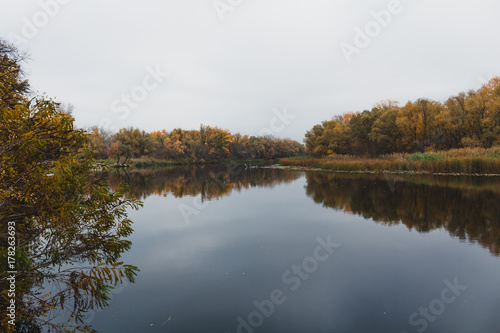 Panoramic landscape with forest lake in autumn