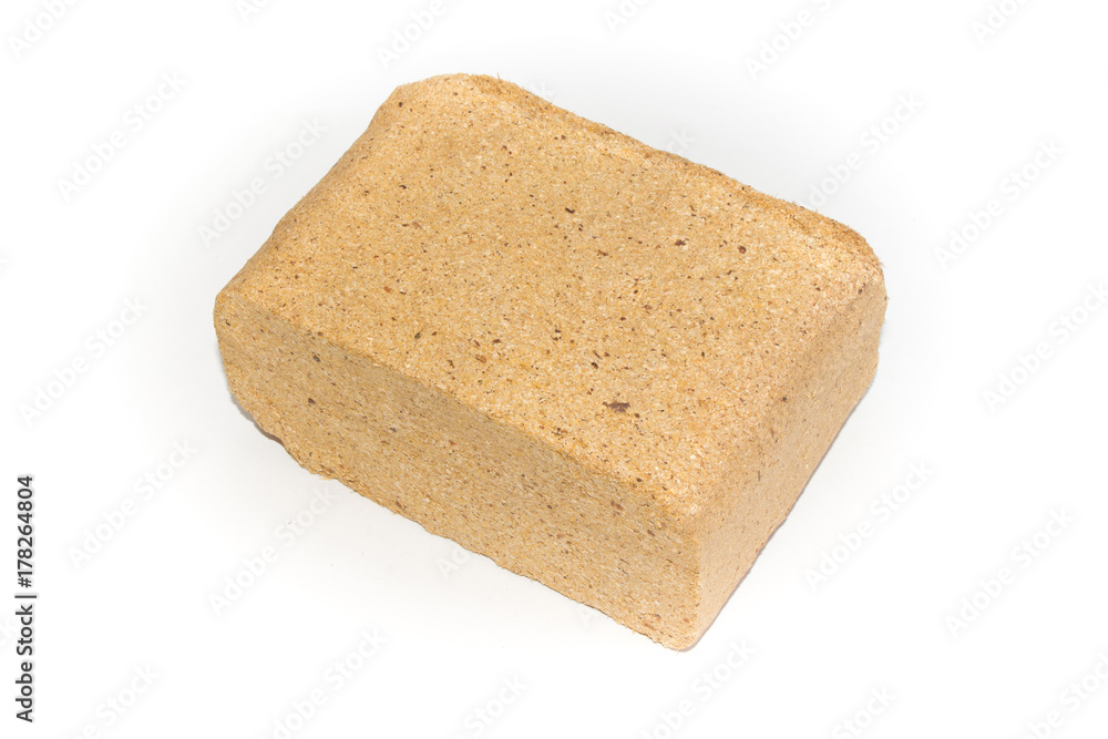Briquettes from hardwood sawdust on a white background. Alternative fuels. ECO-friendly fuel. Biofuel for stoves.