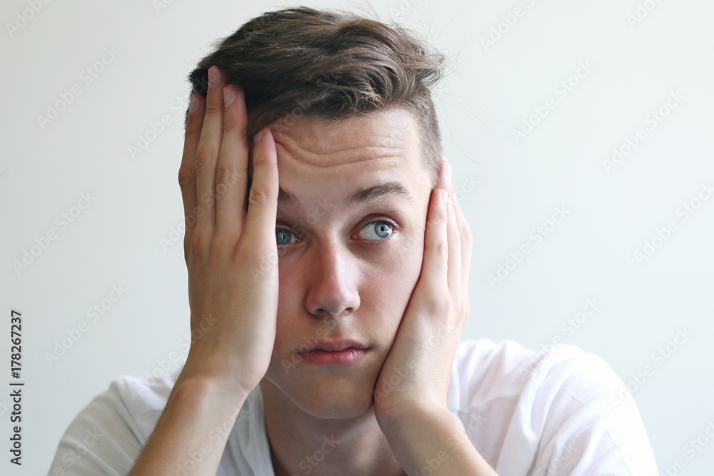 Young man in stress thinking about problem Young man in stress thinking about problem