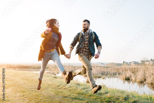 Young tourist couple at sunset sun