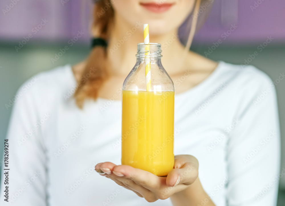Useful orange juice in a glass bottle. The concept of healthy food, diet, vitamins, healthy lifestyle. The concept of healthy food, diet, vitamins, healthy lifestyle. Useful orange juice in a glass bottle. The concept of healthy food, diet, vitamins, healthy lifestyle. The concept of healthy food, diet, vitamins, healthy lifestyle.