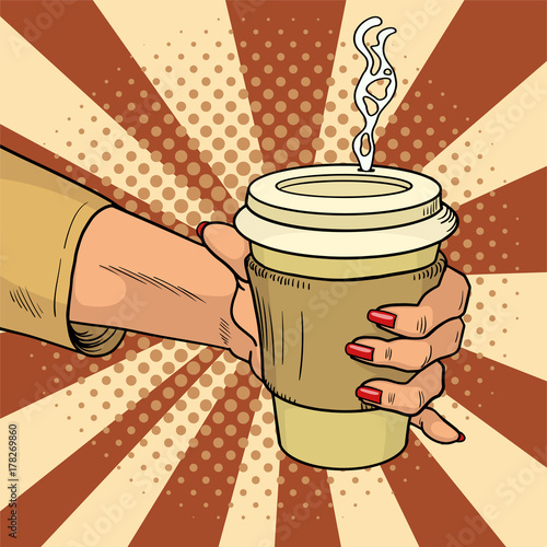 Female hand holds hot cardboard cup with coffee comic style. During a working break she drinks energy drink. Vintage pop art retro vector illustration.