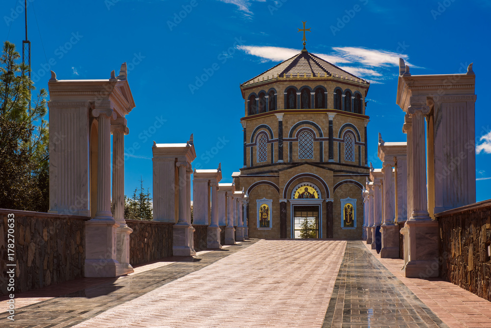 Famous orthodox monastery of Kykkos, Holy monastery of the Virgin of Kykkos in Cyprus. Way to the church near king Macarius grave. Travel sightseeing image
