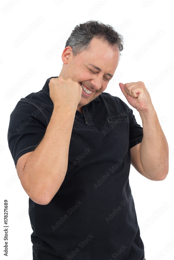 Happy supporter celebrating a goal. He is overweighted and wearing a black polo shirt.. Happy supporter celebrating a goal. He is overweighted and wearing a black polo shirt..