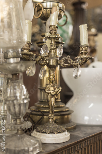 Brass candlestick with sculpture