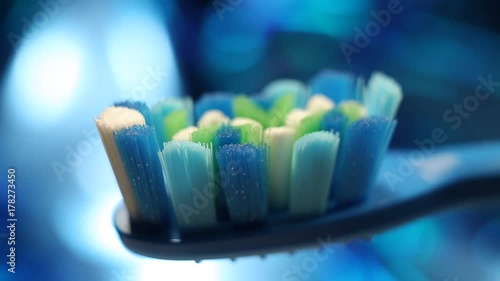 Tooth brushon a background of an abstract blue bokeh photo