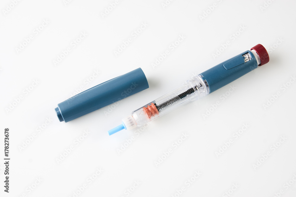 Insulin pen or insulin injector isolated on white Insulin pen or insulin injector isolated on white