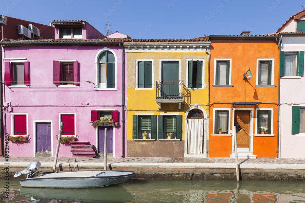 Colorful houses in the fishing village on Burano Island, Venice, Italy known for its lace making and bright colors