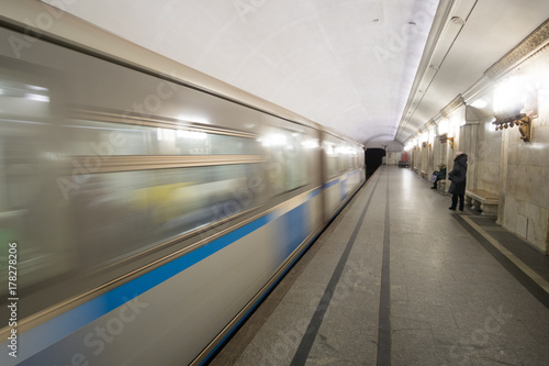 Subway cars speed by in the Moscow metro