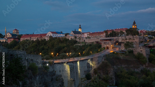 Impressive view at medieval Kamenets-Podolskiy Castle at sunset background, in Ukraine photo