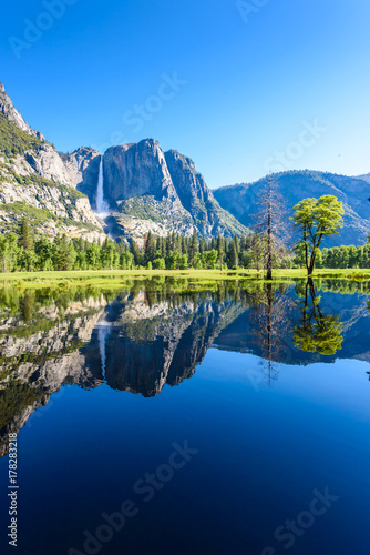 Yosemite National Park - Reflection in Merced River of Yosemite waterfall and beautiful mountain landscape  California  USA