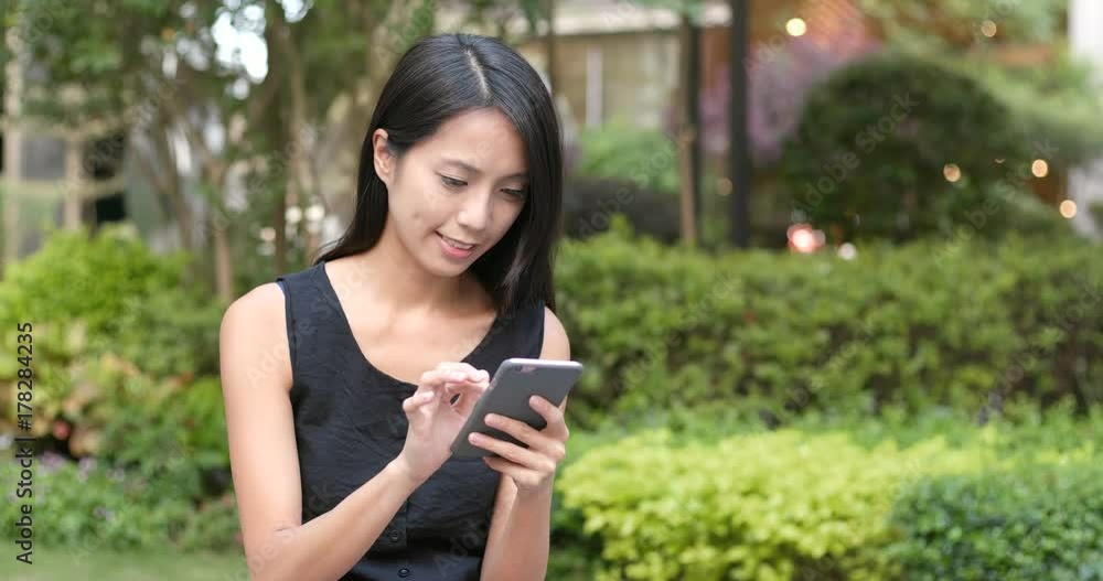 Woman using mobile phone at outdoor Woman using mobile phone at outdoor