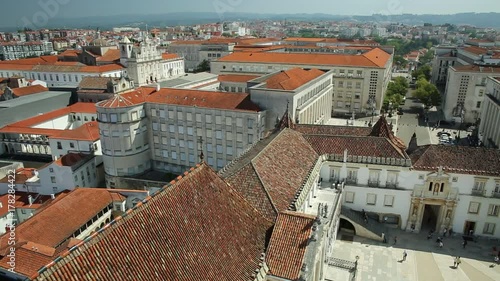 Coimbra uptown aerial view from top of bell clock tower. Coimbra University courtyard and Mondego river on background. Coimbra in Central Portugal, is famous for its University, the oldest in Europe.