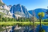 Yosemite National Park - Reflection in Merced River of Yosemite waterfall and beautiful mountain landscape, California, USA