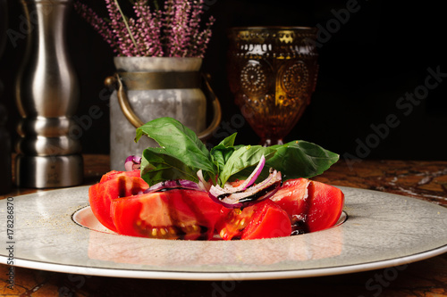 chopped tomato on a plate photo