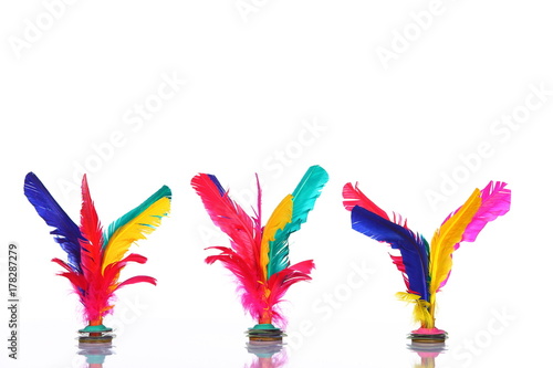 Colorful feather Shuttlecock in red, pink, yellow, green, blue, purple, over white background photo