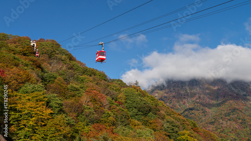 Cable cars riding to Akechidaira observation deck with beautiful autumn season color, Nikko, Japan.