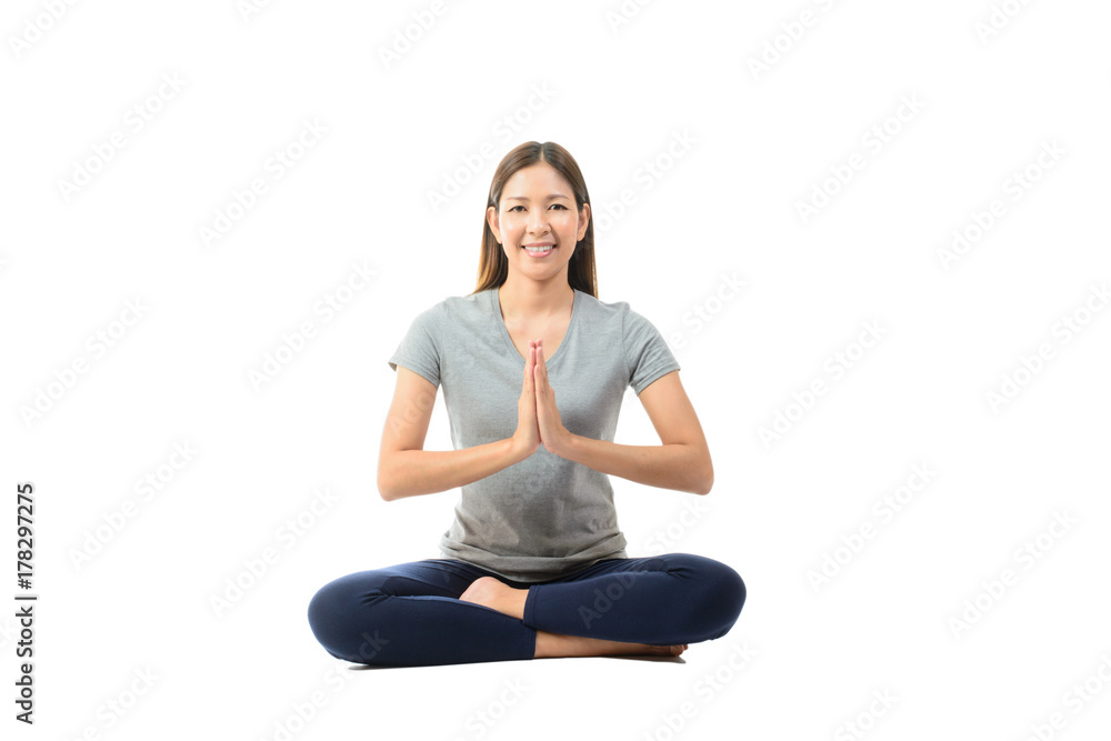 Young asian smiling woman practicing yoga, sitting in easy pose on white background. Young asian smiling woman practicing yoga, sitting in easy pose on white background.
