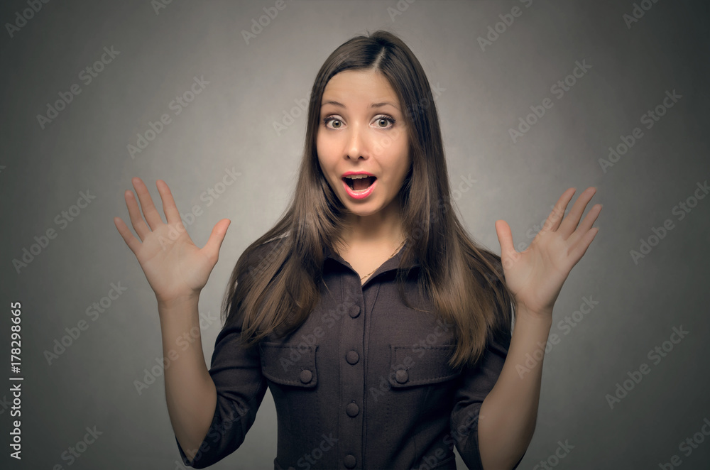 Surprised young woman spread her hands isolated. Unexpected meeting. Surprised young woman spread her hands isolated. Unexpected meeting.