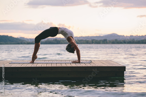 Woman doing yoga outdoors photo