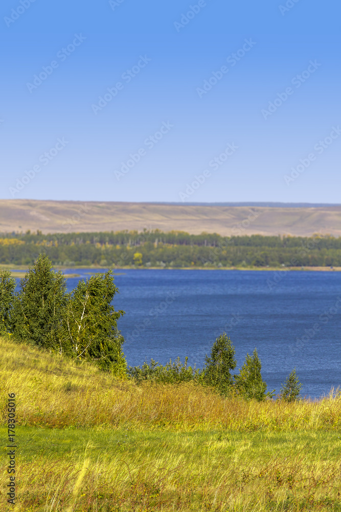 Great blue lake on a clear sunny day. - obrazy, fototapety, plakaty 