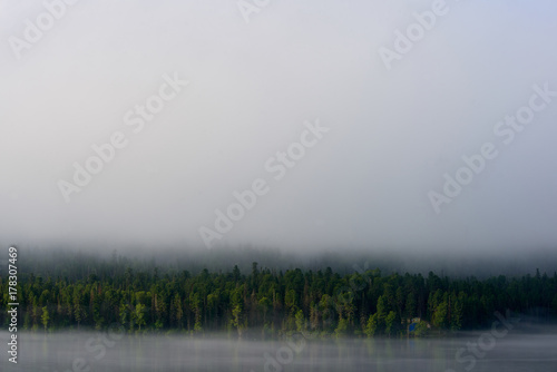Fog on Lake Teletskoye Lake Teletskoye is the largest lake in the Altai Mountains and the Altai Republic, Russia, and has depth up to 325 meters.