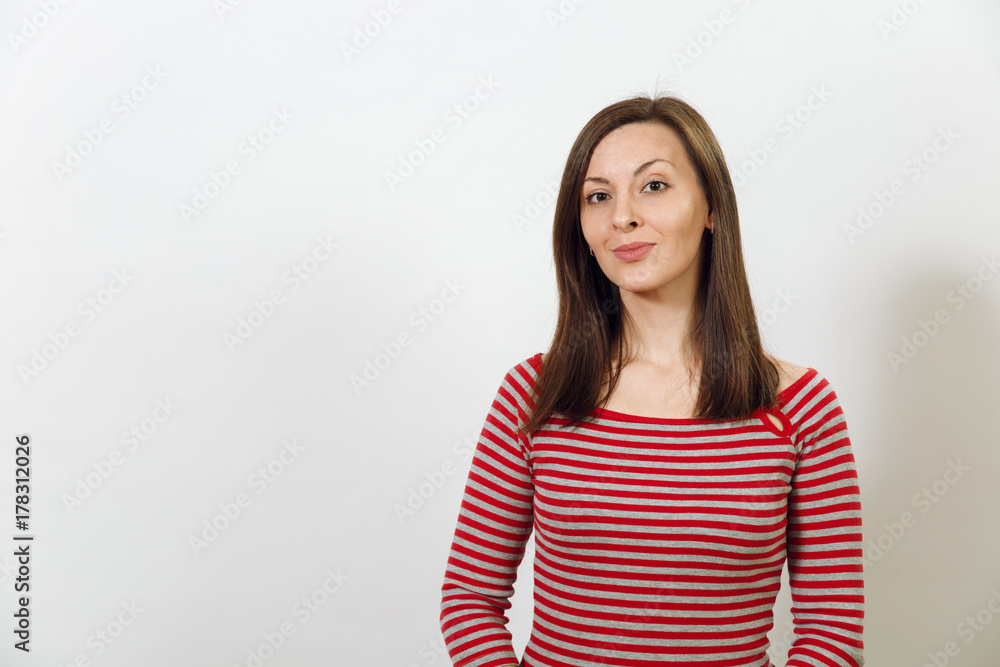 Gorgeous European young happy brown-haired woman with healthy clean skin and charming smile, dressed in casual red and grey clothes, laughing and enjoying on a white background. Emotions concept. Gorgeous European young happy brown-haired woman with healthy clean skin and charming smile, dressed in casual red and grey clothes, laughing and enjoying on a white background. Emotions concept.