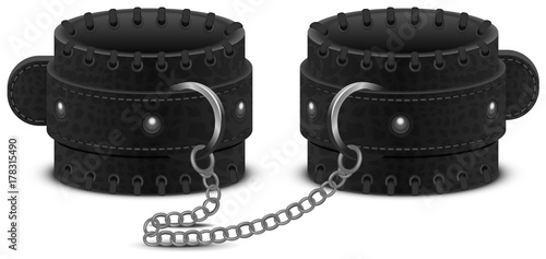 Black leather handcuffs on chain. Accessory toy for fetish bdsm game