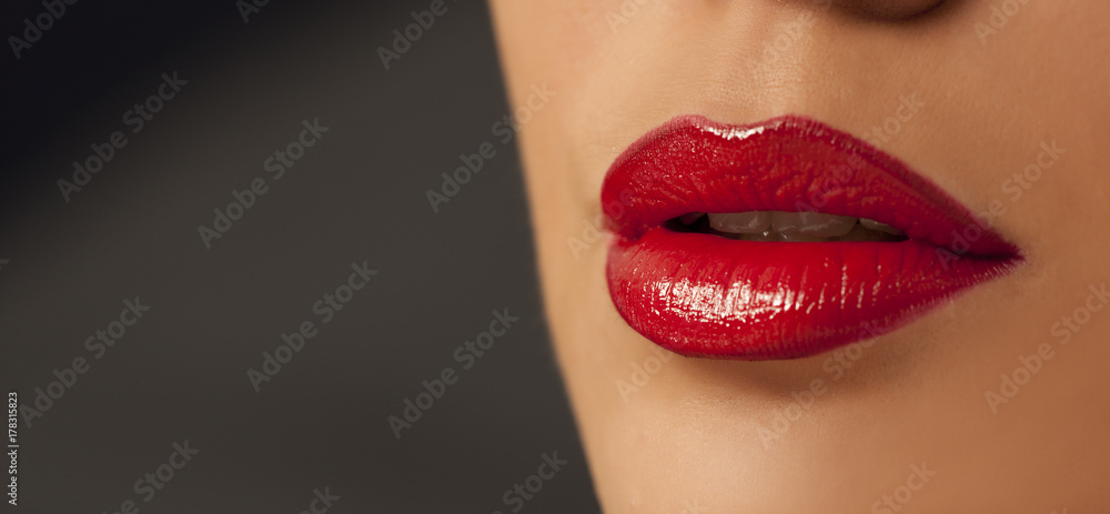 Fototapeta premium beautiful lips with red lipstick