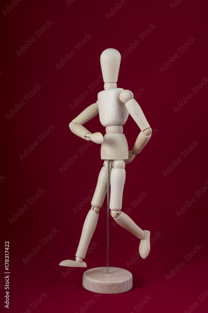 a wooden dummy dancing with red background a wooden dummy dancing with red background