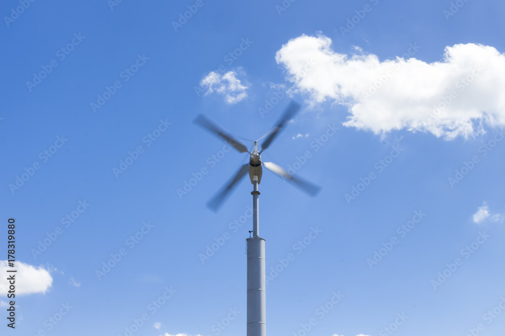 the wind turbines againt blue sky the wind turbines againt blue sky
