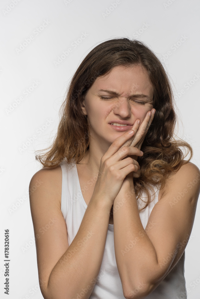 Young beautiful giirl on white background with toothache Young beautiful giirl on white background with toothache