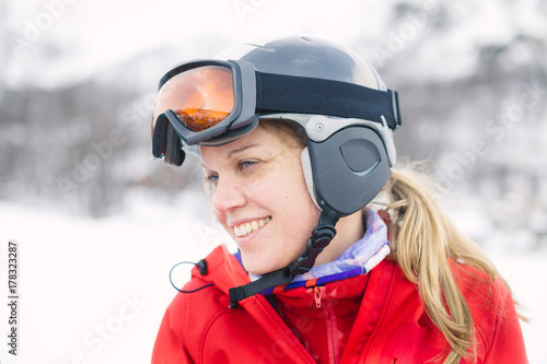 Women with helmet and googles ready for skiing with a smile photo