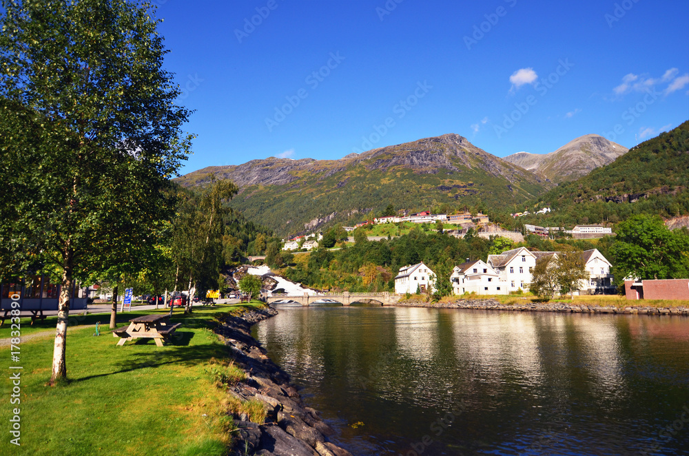 Waterfall in Hellesylt, a small town at the entrance to Geirangerfjord on a sunny summer day