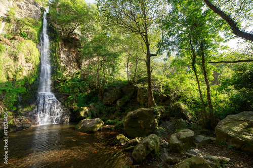 Landscape of one of water cascades of Oneta waterfalls in picturesque forest of Asturias  Spain.  