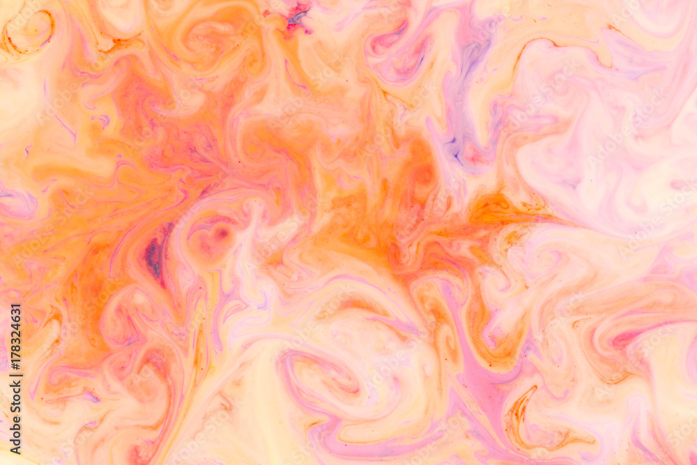 Artistic abstract design created with mixing color liquids. Colorful background texture. Liquids mixing on water surface Artistic abstract design created with mixing color liquids. Colorful background texture. Liquids mixing on water surface