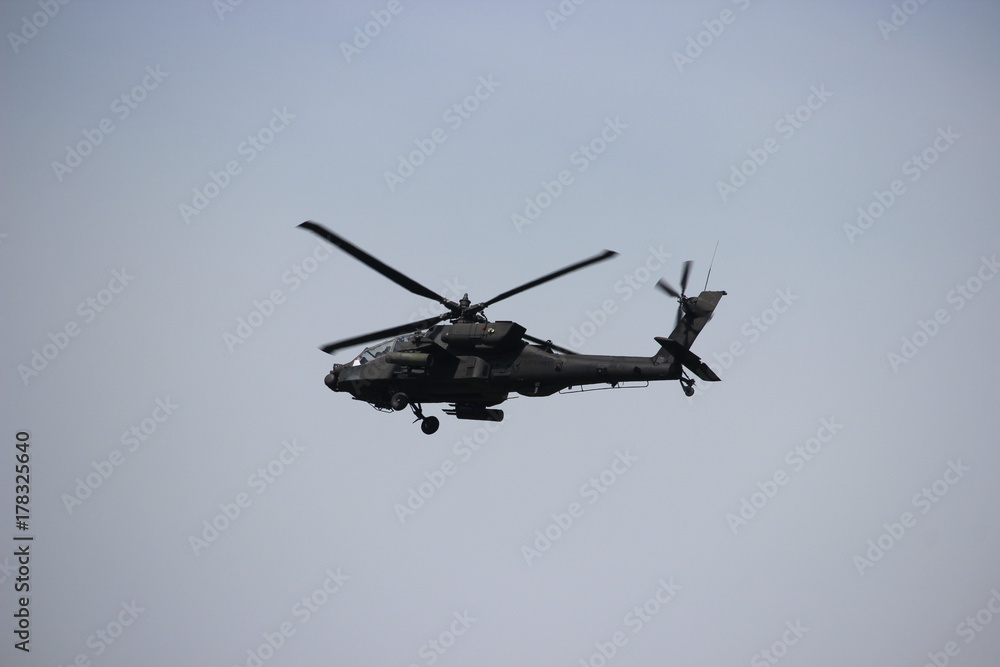 Apache helicopter in flight on military exercise mission. Apache helicopter in flight on military exercise mission.