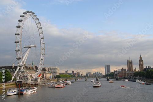 View of London Eye, Southwark, Palace of Westminster and Big Ben at sunset from Golden Jubilee Bridges
