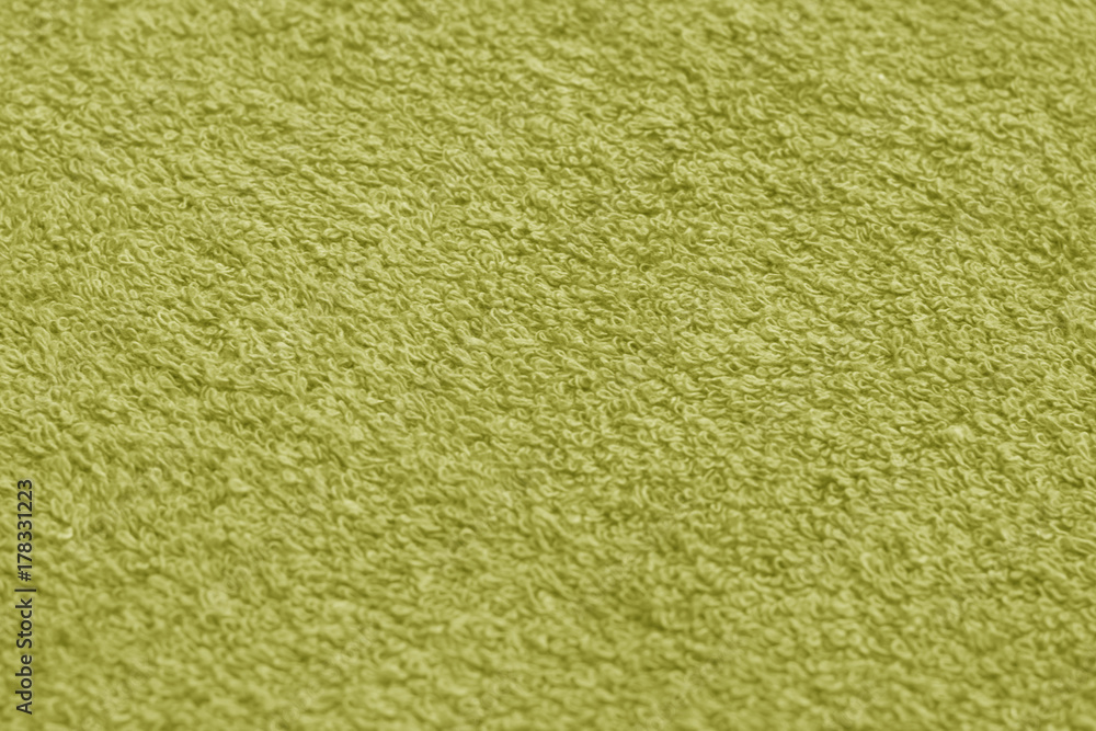 Yellow color towel surface close-up with blur effect. Yellow color towel surface close-up with blur effect.
